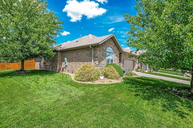 2419 W Deerbrooke Trl, Ozark, MO 65721 - view of side of property with a garage, driveway, and stone siding