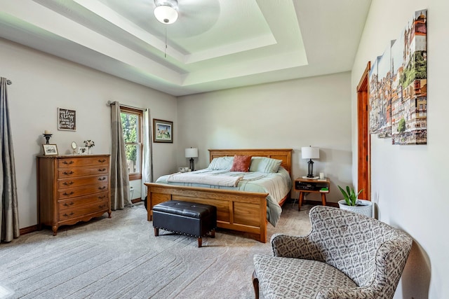 2419 W Deerbrooke Trl, Ozark, MO 65721 - bedroom featuring light carpet, a tray ceiling, and ceiling fan