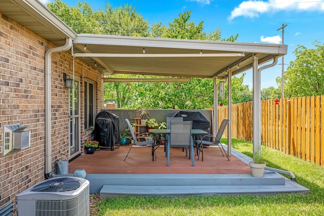 2419 W Deerbrooke Trl, Ozark, MO 65721 - wooden terrace with area for grilling, a fenced backyard, and outdoor dining space