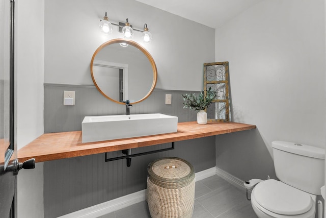 2311 S Golden Ave, Springfield, MO 65807 - bathroom featuring wainscoting and tile patterned floors