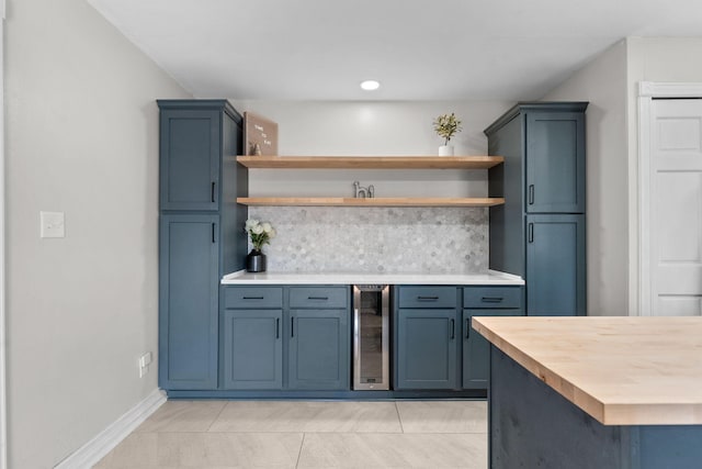2311 S Golden Ave, Springfield, MO 65807 - kitchen featuring open shelves, wine cooler, tasteful backsplash, butcher block countertops, and light tile patterned floors