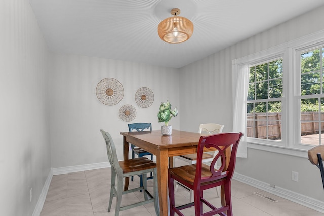 2311 S Golden Ave, Springfield, MO 65807 - dining area featuring baseboards and light tile patterned flooring