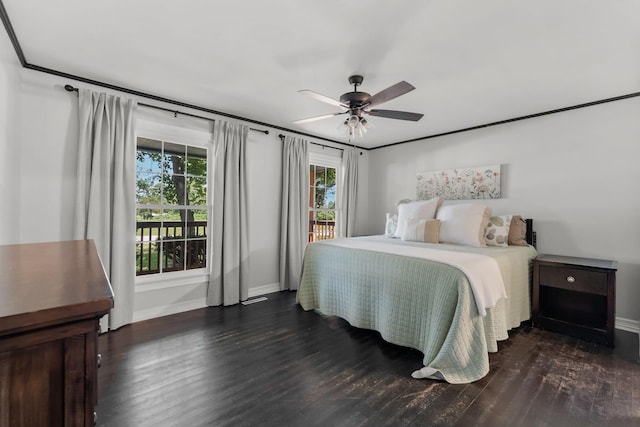 2311 S Golden Ave, Springfield, MO 65807 - bedroom with multiple windows, wood finished floors, and ceiling fan