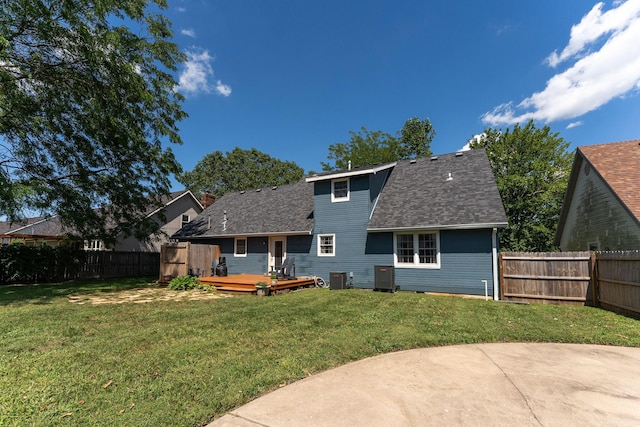 2311 S Golden Ave, Springfield, MO 65807 - back of property with a fenced backyard, a deck, a patio area, and roof with shingles