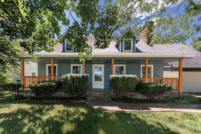 2311 S Golden Ave, Springfield, MO 65807 - view of front of house featuring an attached garage, a porch, and a front yard