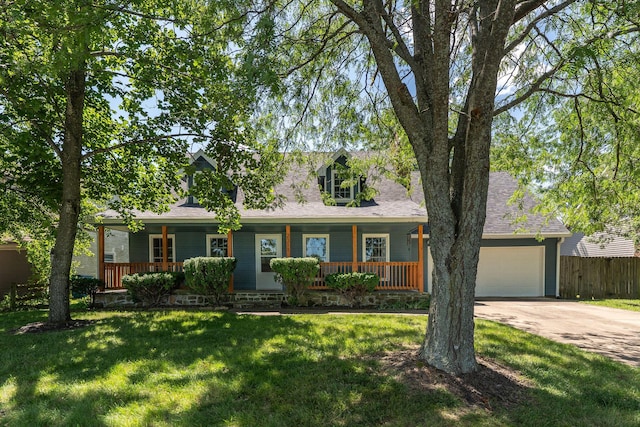 2311 S Golden Ave, Springfield, MO 65807 - view of front facade with a porch, driveway, a garage, and a shingled roof