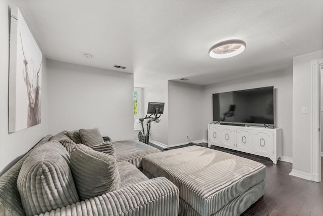 2311 S Golden Ave, Springfield, MO 65807 - living area with baseboards and dark wood finished floors