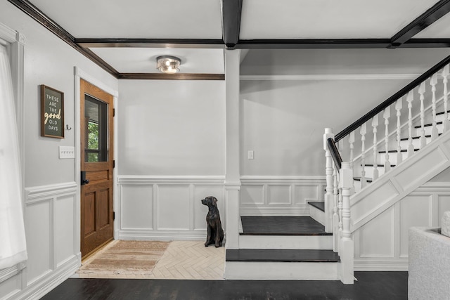 2311 S Golden Ave, Springfield, MO 65807 - foyer entrance featuring a decorative wall, stairway, wood finished floors, and wainscoting