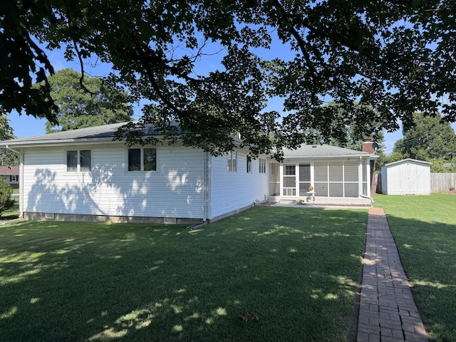 104 E Meadowbrook Ave, Clever, MO 65631 - rear view of house featuring a shed, a sunroom, a lawn, and a chimney