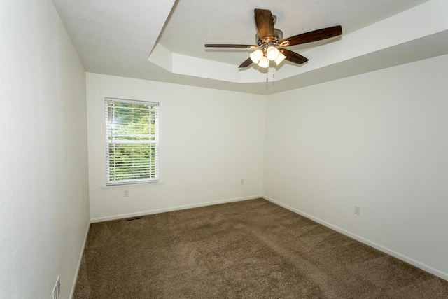 297 Kelsi Ln, Branson, MO 65616 - unfurnished room featuring carpet flooring, ceiling fan, and a raised ceiling