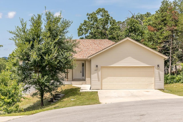 297 Kelsi Ln, Branson, MO 65616 - view of front facade featuring concrete driveway, an attached garage, and roof with shingles