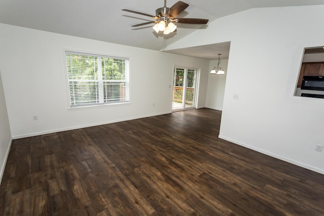 297 Kelsi Ln, Branson, MO 65616 - spare room with a ceiling fan, a chandelier, vaulted ceiling, and dark wood-style flooring
