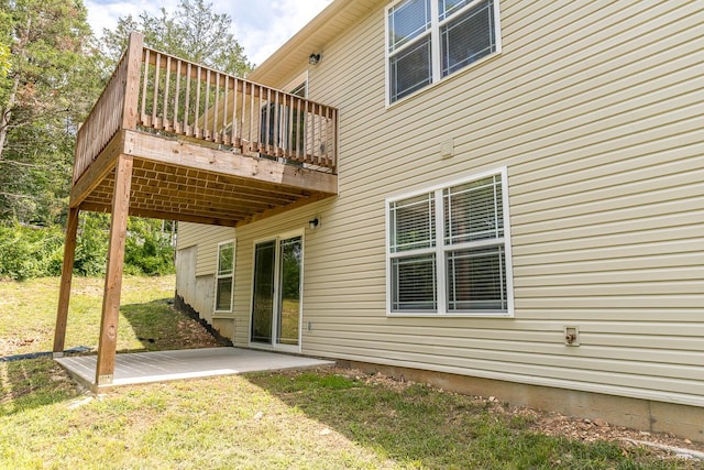 297 Kelsi Ln, Branson, MO 65616 - rear view of house featuring a deck, a lawn, and a patio area