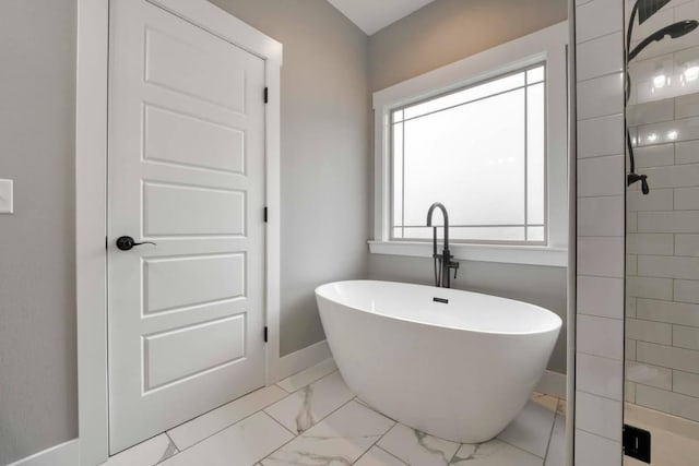 4212 Tuscany Cir, Ozark, MO 65721 - full bath featuring marble finish flooring, a freestanding bath, and a tile shower