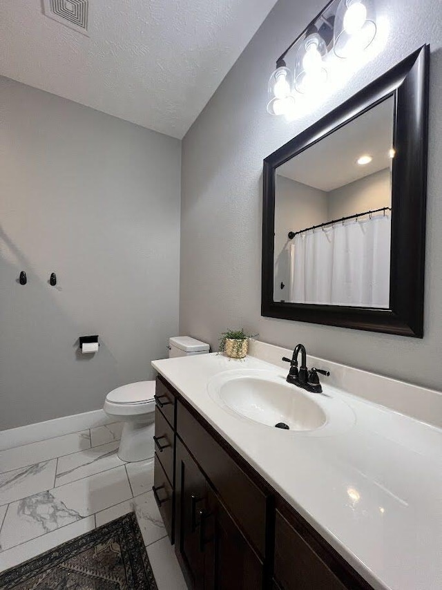 4212 Tuscany Cir, Ozark, MO 65721 - bathroom featuring vanity, marble look tiles, and a textured ceiling