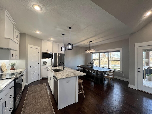4212 Tuscany Cir, Ozark, MO 65721 - kitchen with stainless steel appliances, premium range hood, backsplash, white cabinets, and recessed lighting