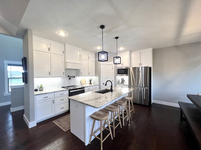 4212 Tuscany Cir, Ozark, MO 65721 - kitchen featuring stainless steel appliances, white cabinets, light stone counters, decorative backsplash, and recessed lighting