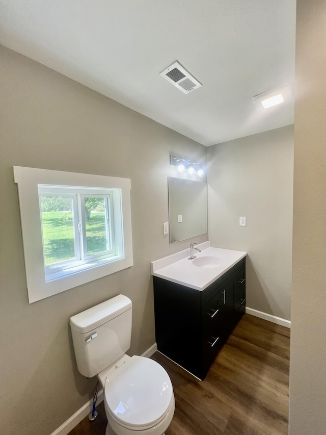 711 W Woodbine Rd, Ash Grove, MO 65604 - bathroom featuring vanity and wood finished floors