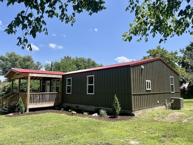 711 W Woodbine Rd, Ash Grove, MO 65604 - view of side of property featuring a yard and a deck