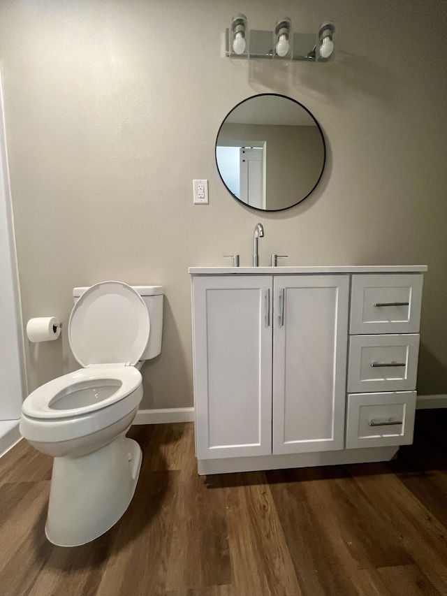 711 W Woodbine Rd, Ash Grove, MO 65604 - half bath featuring wood finished floors and vanity