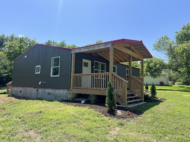 711 W Woodbine Rd, Ash Grove, MO 65604 - view of front of property featuring crawl space, a front yard, and covered porch