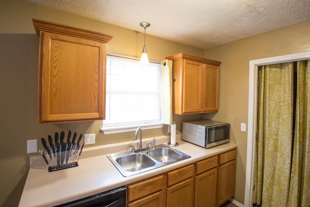 602 E Robertson, Ozark, MO 65721 - kitchen with stainless steel microwave, light countertops, a textured ceiling, pendant lighting, and dishwasher