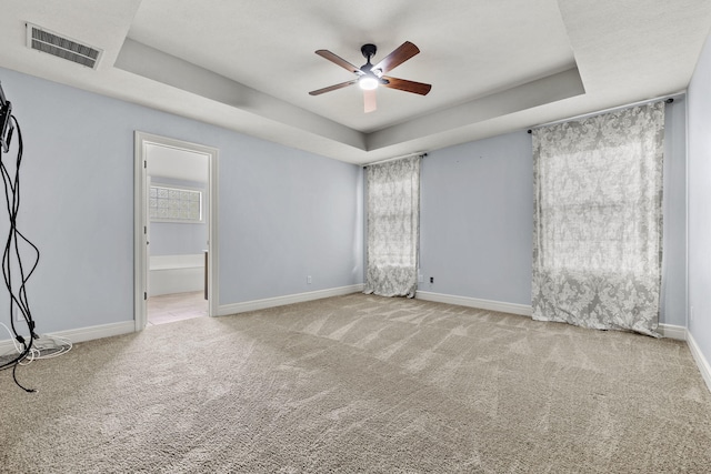 5323 S Carson St, Battlefield, MO 65619 - unfurnished room with a raised ceiling, ceiling fan, and carpet