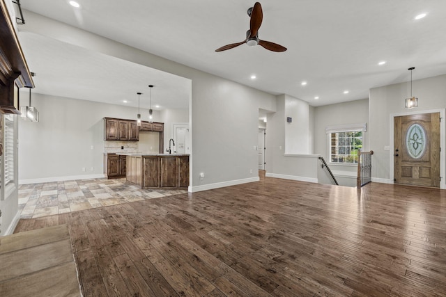 5323 S Carson St, Battlefield, MO 65619 - unfurnished living room with ceiling fan, hardwood / wood-style flooring, and recessed lighting