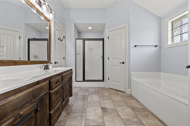 5323 S Carson St, Battlefield, MO 65619 - full bathroom featuring a stall shower, double vanity, and a garden tub