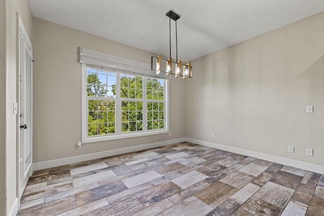 5323 S Carson St, Battlefield, MO 65619 - unfurnished room with a chandelier and baseboards