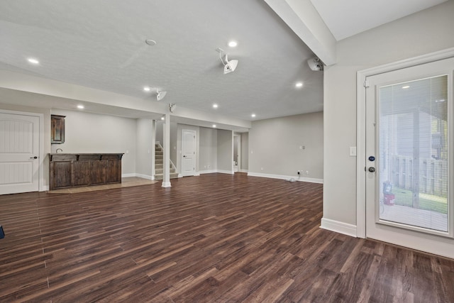 5323 S Carson St, Battlefield, MO 65619 - unfurnished living room with bar area, dark wood-style floors, recessed lighting, and stairs