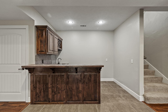 5323 S Carson St, Battlefield, MO 65619 - bar area with stairway, recessed lighting, backsplash, and light wood finished floors