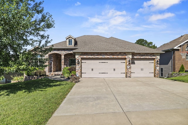 5323 S Carson St, Battlefield, MO 65619 - view of front of home with a front yard, concrete driveway, a garage, brick siding, and roof with shingles