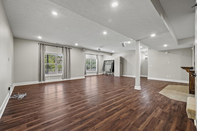 5323 S Carson St, Battlefield, MO 65619 - unfurnished living room featuring dark wood-style floors, recessed lighting, and a textured ceiling