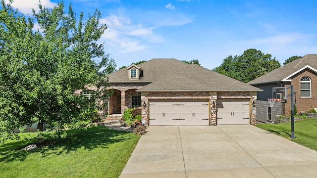 5323 S Carson St, Battlefield, MO 65619 - view of front of home with driveway, a front lawn, an attached garage, a shingled roof, and brick siding