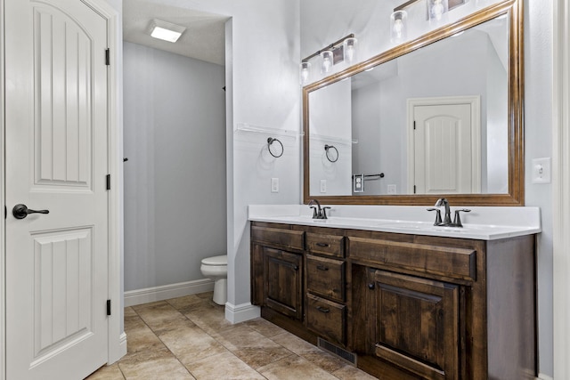 5323 S Carson St, Battlefield, MO 65619 - bathroom with double vanity and toilet