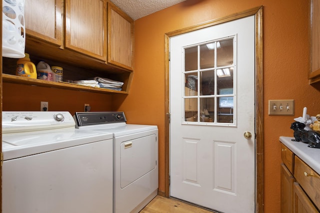 508 N Cherry Cir, Nixa, MO 65714 - laundry room with cabinet space, separate washer and dryer, light wood-type flooring, and a textured ceiling