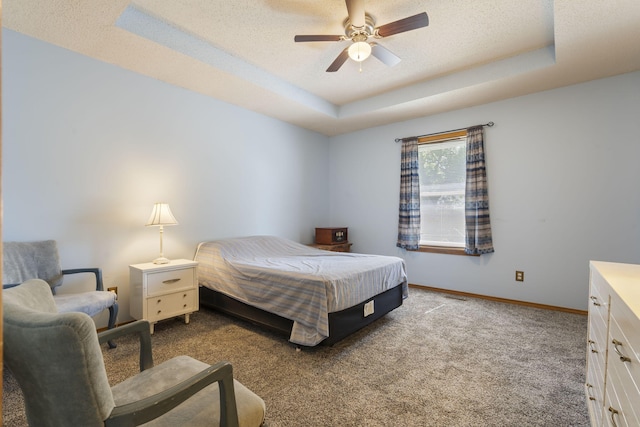 508 N Cherry Cir, Nixa, MO 65714 - carpeted bedroom featuring a raised ceiling, a textured ceiling, and a ceiling fan