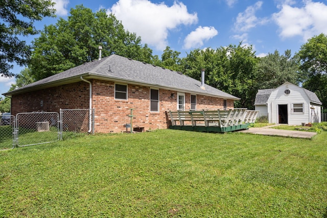 508 N Cherry Cir, Nixa, MO 65714 - rear view of house with a deck, brick siding, a gate, an outbuilding, and a shingled roof