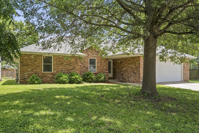 508 N Cherry Cir, Nixa, MO 65714 - view of front of house featuring a garage, concrete driveway, and brick siding