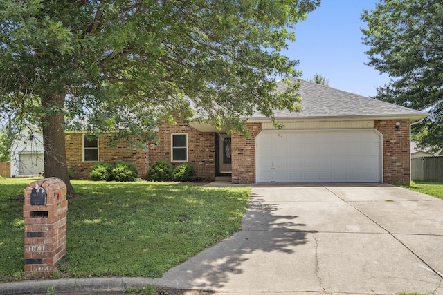 508 N Cherry Cir, Nixa, MO 65714 - view of front of property with concrete driveway, a garage, a front lawn, brick siding, and a shingled roof