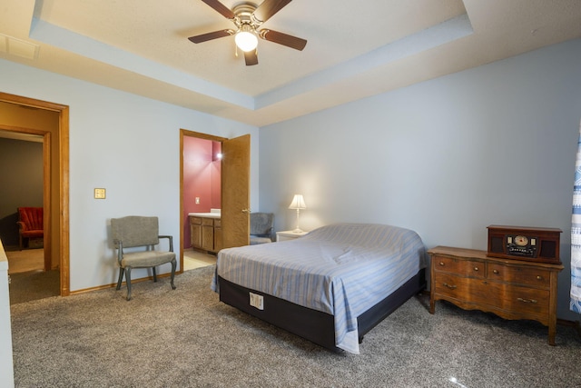 508 N Cherry Cir, Nixa, MO 65714 - bedroom with carpet flooring, a tray ceiling, and ceiling fan