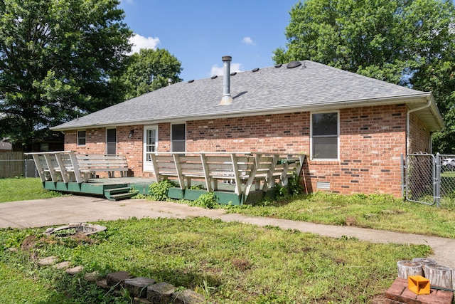 508 N Cherry Cir, Nixa, MO 65714 - back of house with a shingled roof, a wooden deck, brick siding, and a gate