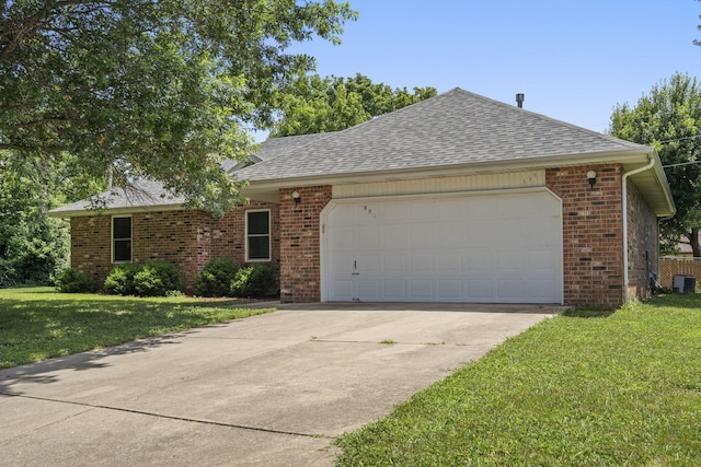 508 N Cherry Cir, Nixa, MO 65714 - single story home featuring an attached garage, brick siding, driveway, a front yard, and a shingled roof