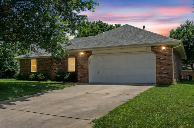 508 N Cherry Cir, Nixa, MO 65714 - ranch-style house featuring a garage, driveway, brick siding, a yard, and a shingled roof