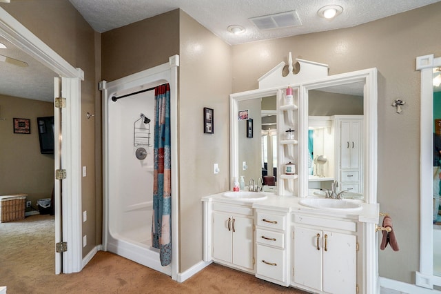 1343 Woodlawn Ave, Mount Vernon, MO 65712 - full bathroom with a shower stall, double vanity, and a textured ceiling