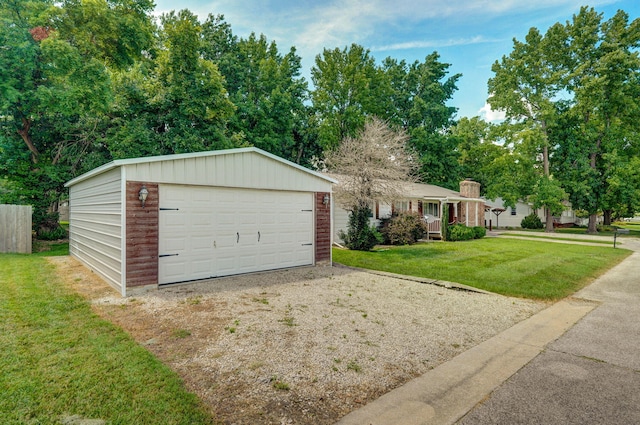 1343 Woodlawn Ave, Mount Vernon, MO 65712 - ranch-style house with a front yard, an outdoor structure, and a garage