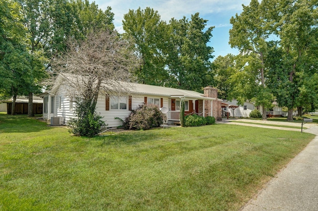 1343 Woodlawn Ave, Mount Vernon, MO 65712 - ranch-style house with covered porch, a front yard, and a chimney