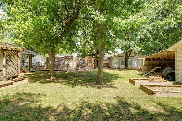 1343 Woodlawn Ave, Mount Vernon, MO 65712 - view of yard with a vegetable garden and a pergola
