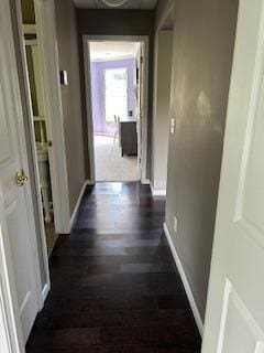 134 Meadowbrook Ln, Walnut Shade, MO 65771 - hallway with dark wood-style flooring and baseboards